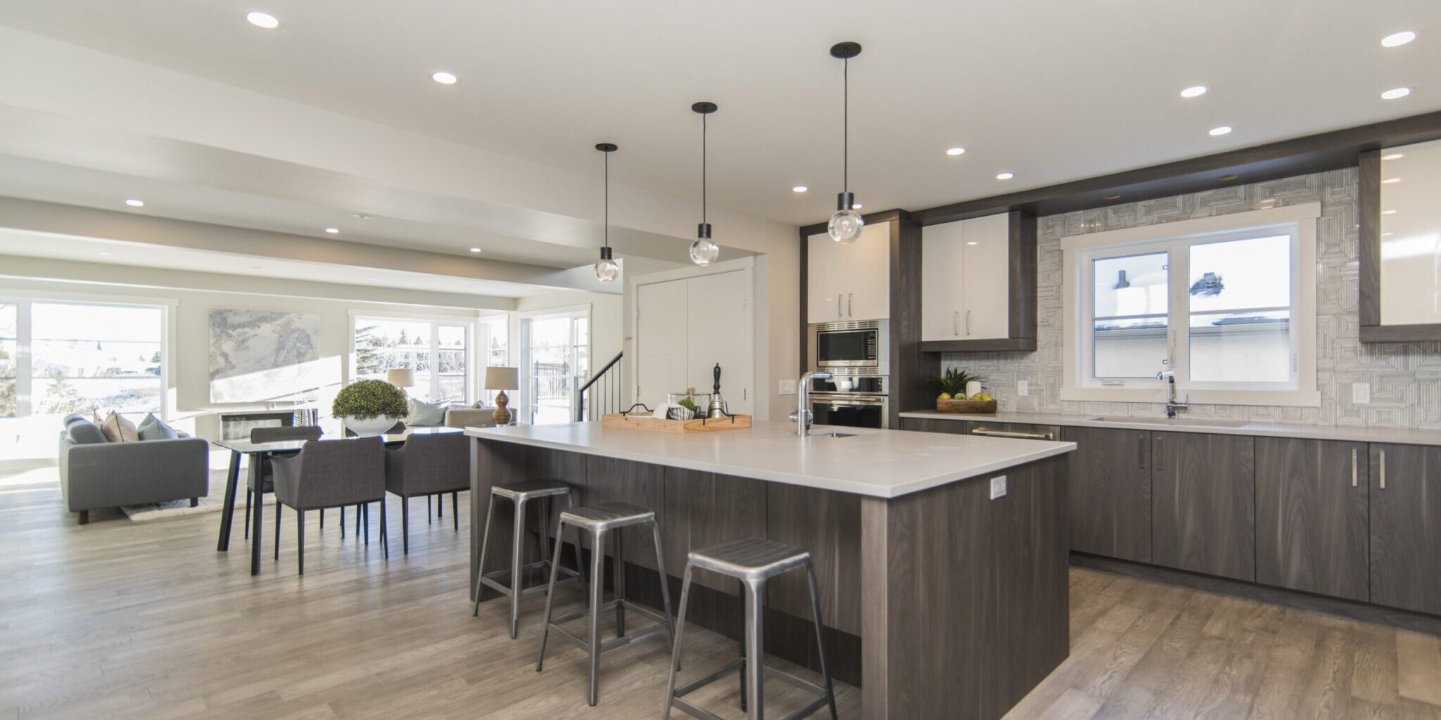 A beautiful shot of a modern house kitchen and dining room