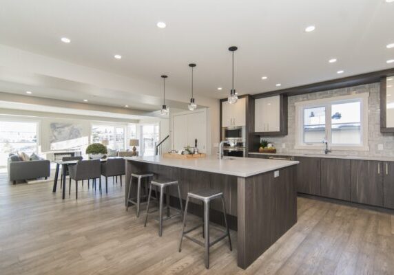 A beautiful shot of a modern house kitchen and dining room